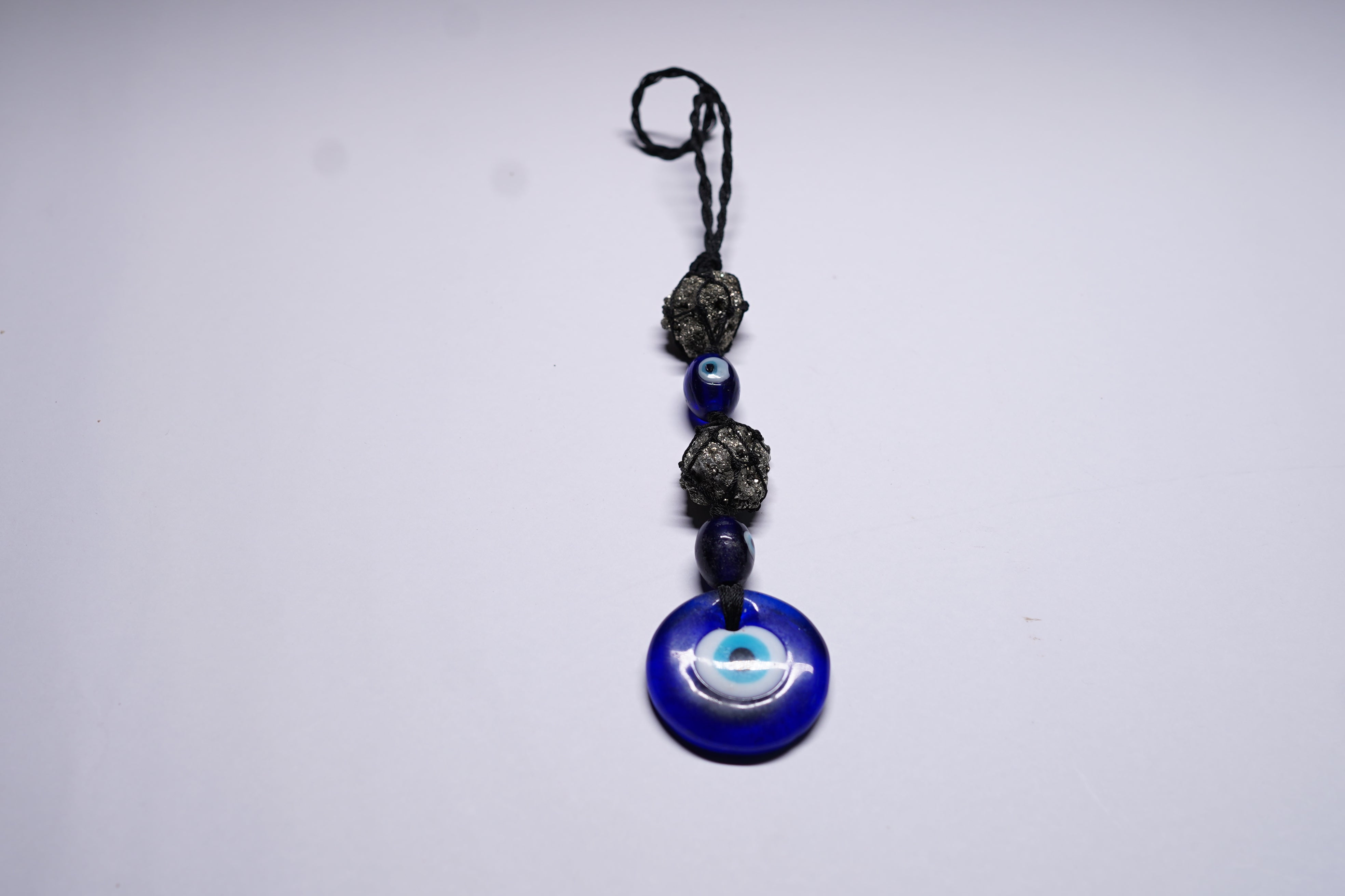 Pyrite Cluster with Evil Eye Hanging