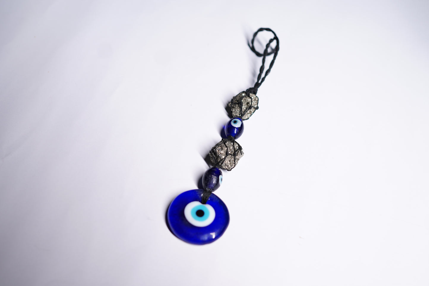 Pyrite Cluster with Evil Eye Hanging